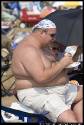 fat-shirtless-guy-eating-cheeseburger-1